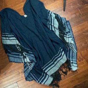 Woman’s navy blue sweater poncho